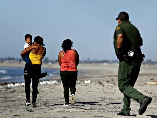 Caravan Migrants Seek Asylum After Crossing Under Border Wall